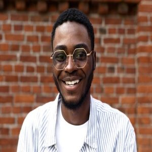 close-up-smiley-man-with-glasses_23-2149009406-1-300x300